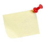 yellow post it note with tack isolated on white