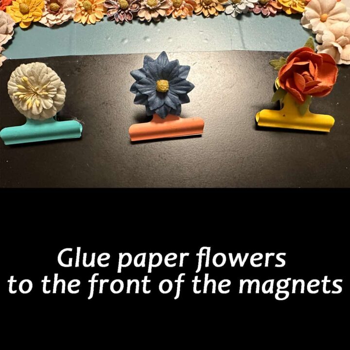 glue the paper flowers to the front of the magnet clips