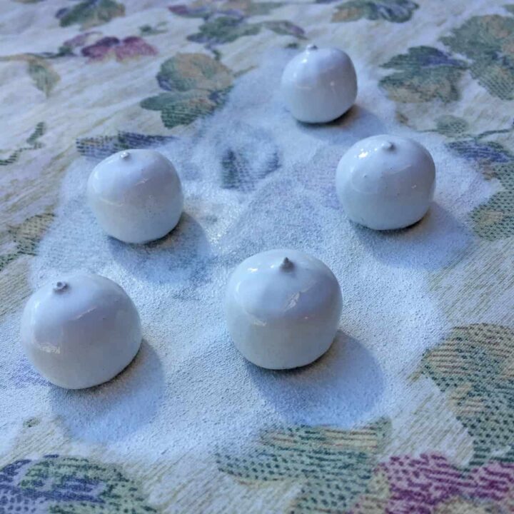 Paint the bottom of the acorns white