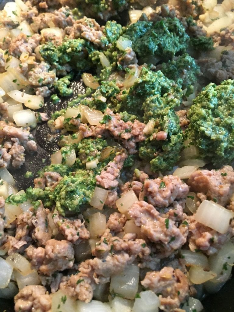 add pesto sauce to meat mixture