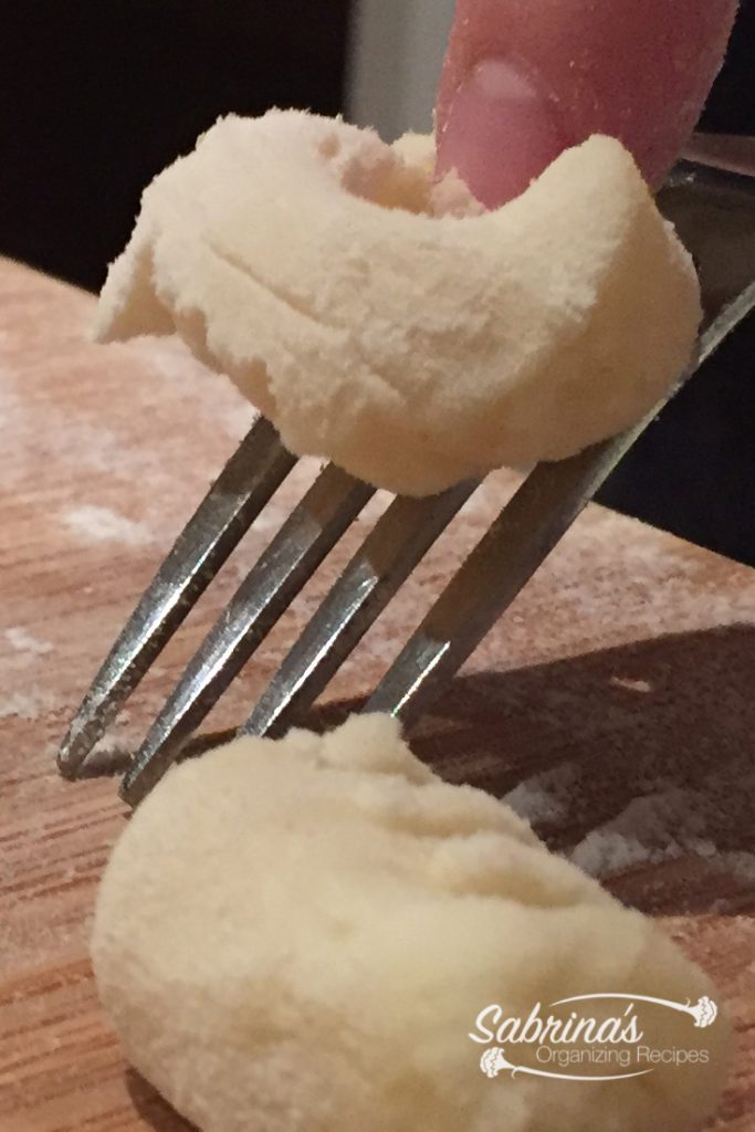 Roll up gnocchi on a fork