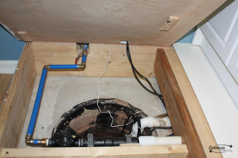 sump pump hidden in basement