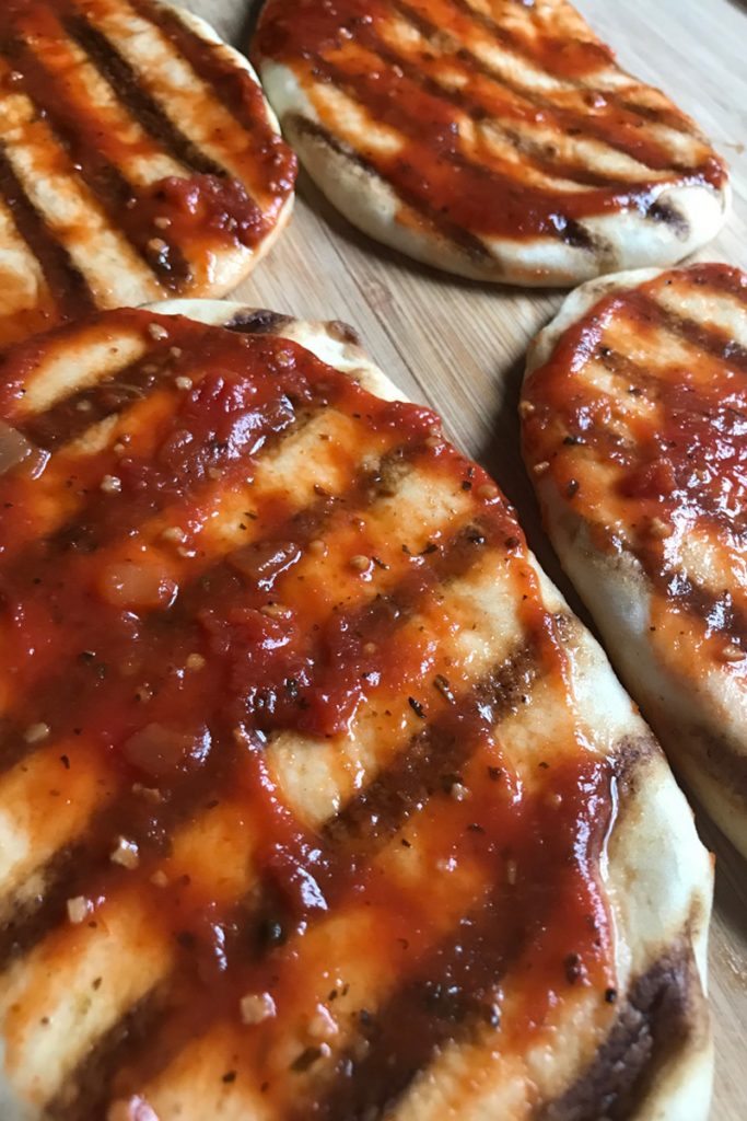 add tomato sauce to flatbread