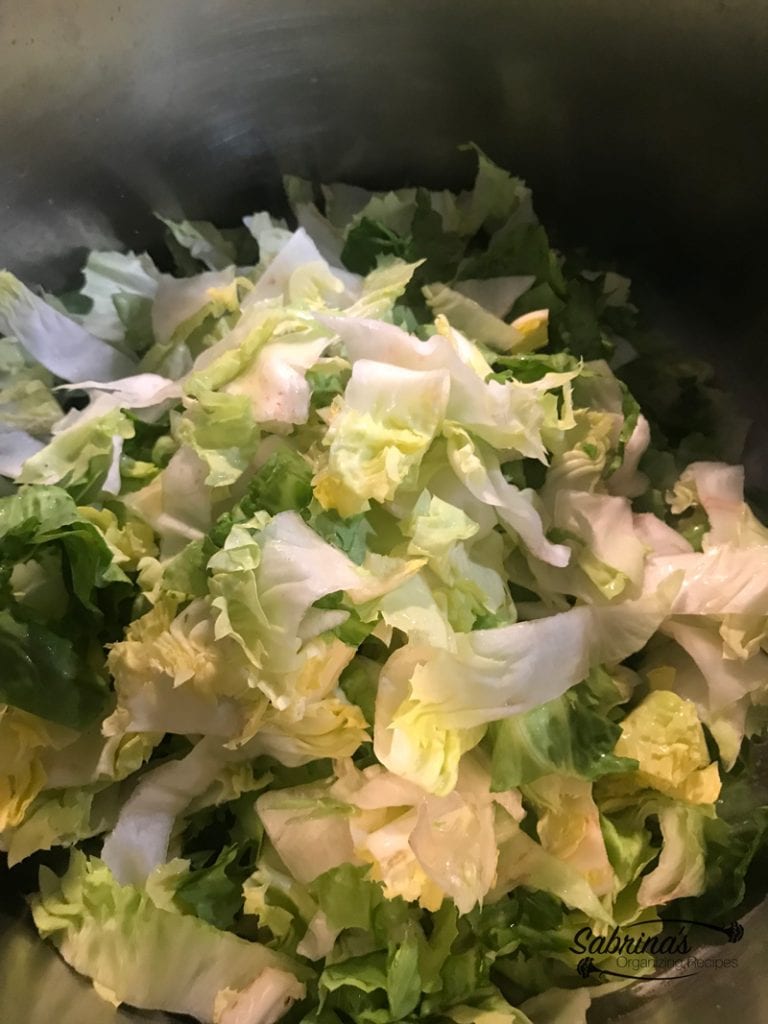 Escarole cleaned chopped in a large sauce pan