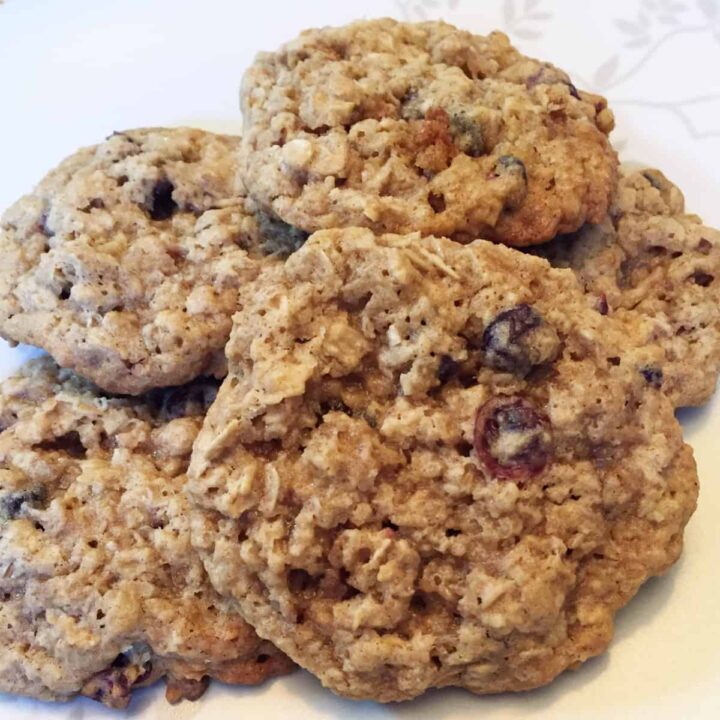 Gluten Free Cranberry Coconut Oatmeal Cookies - square image - cookies on a plate