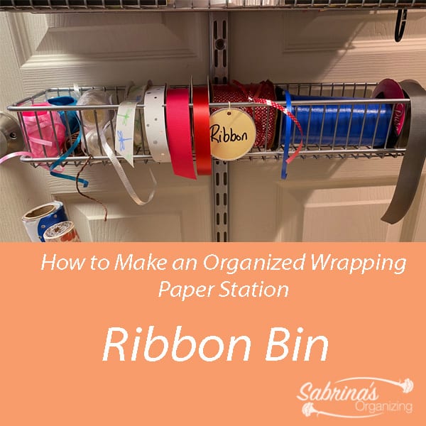 Ribbon bin in the organized over the door wrapping paper station