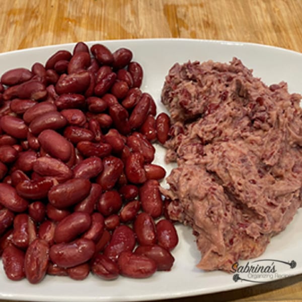 Add half of the canned red beans to the food processor pulsing until it gets mushy
