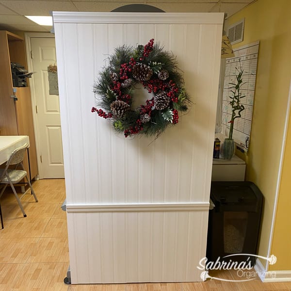 After armoire back with wreath