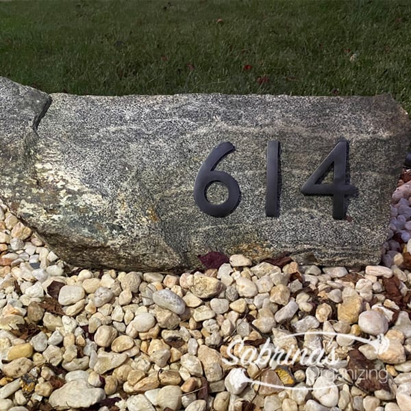 boulder with address numbers on it