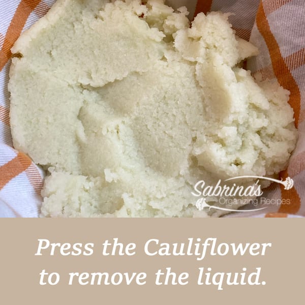 Press the cauliflower to remove the excess liquid