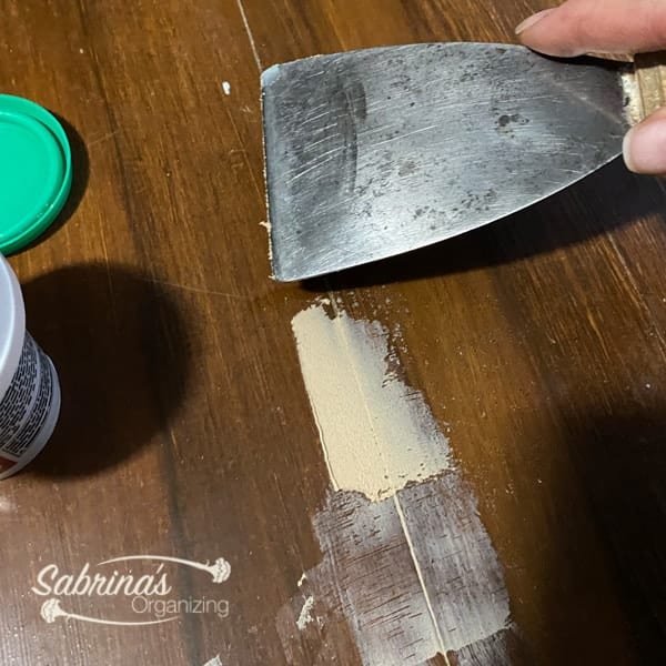 Use Wood Putty to Fill in the crack on the top