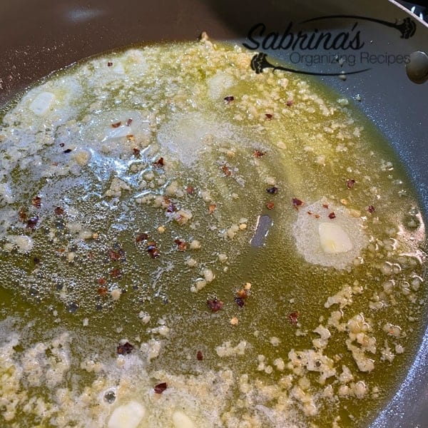 Add butter, oil, and garlic to skillet