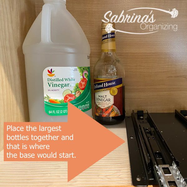 Place the largest two bottles together and that is where the base would start