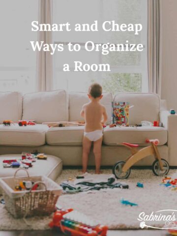 Messy living room with a baby standing near a sofa with toys everywhere - title over lay at the top center