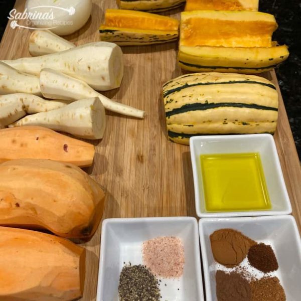 Roasted Sweet Potato, Delicata Squash, and Parsnip Recipe ingredients on a cutting board