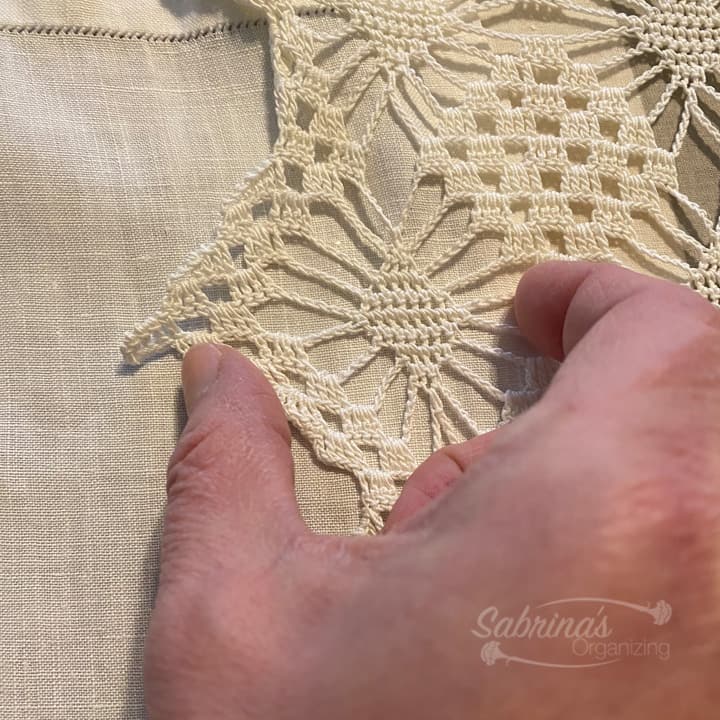 overlap the lace runner over linen towel