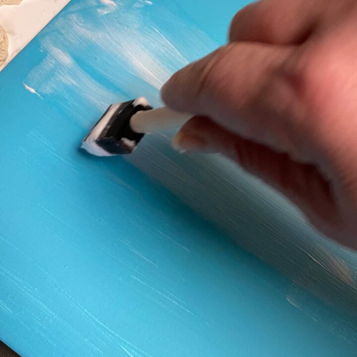 add glue to painted canvas