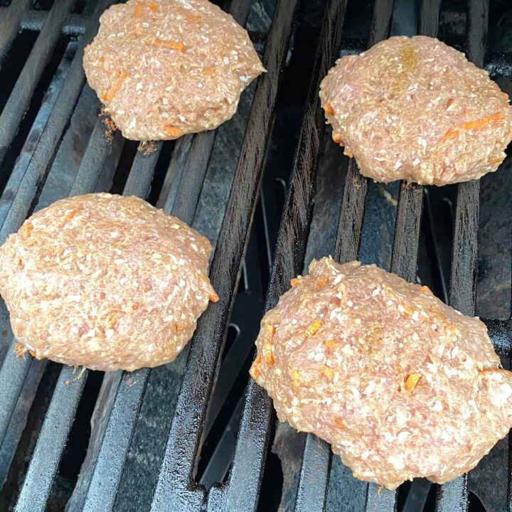 Add turkey burgers to the grill to cook