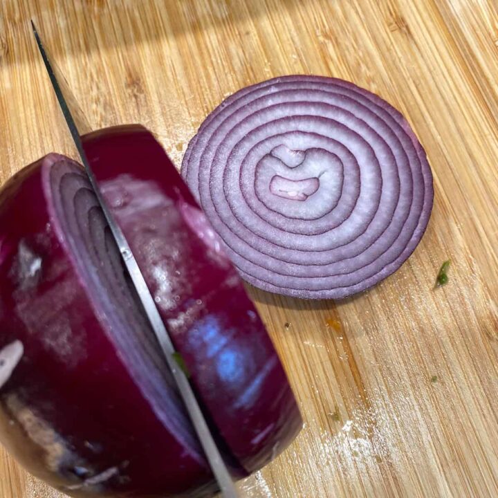 Slice red onion into ½ inch slices and cut in quarters