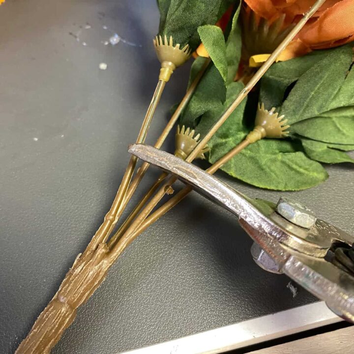 Cut the silk bouquet flowers with tin snips