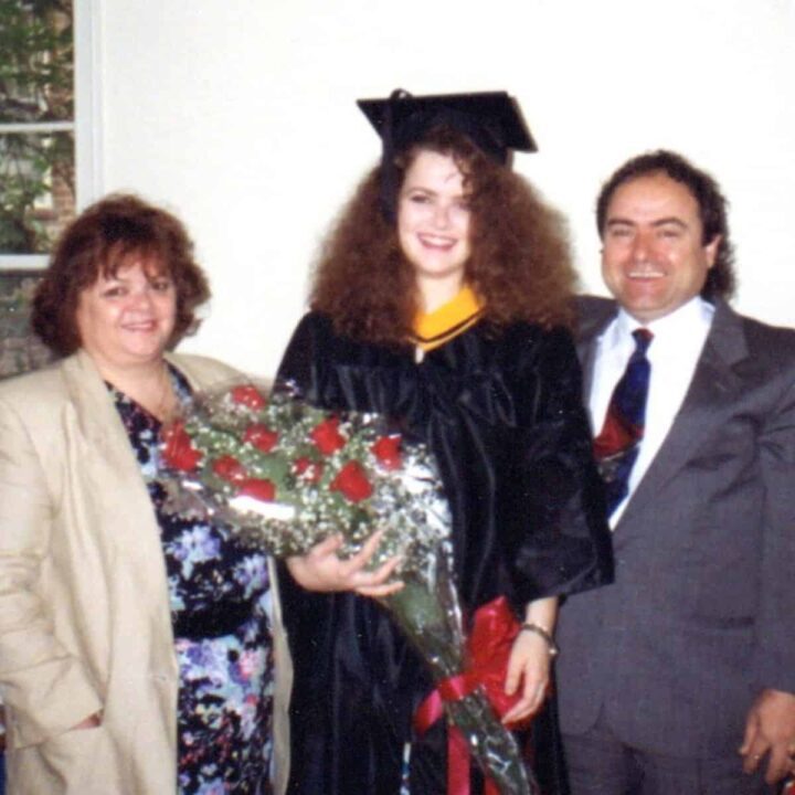 SMQ at college graduation picture with parents