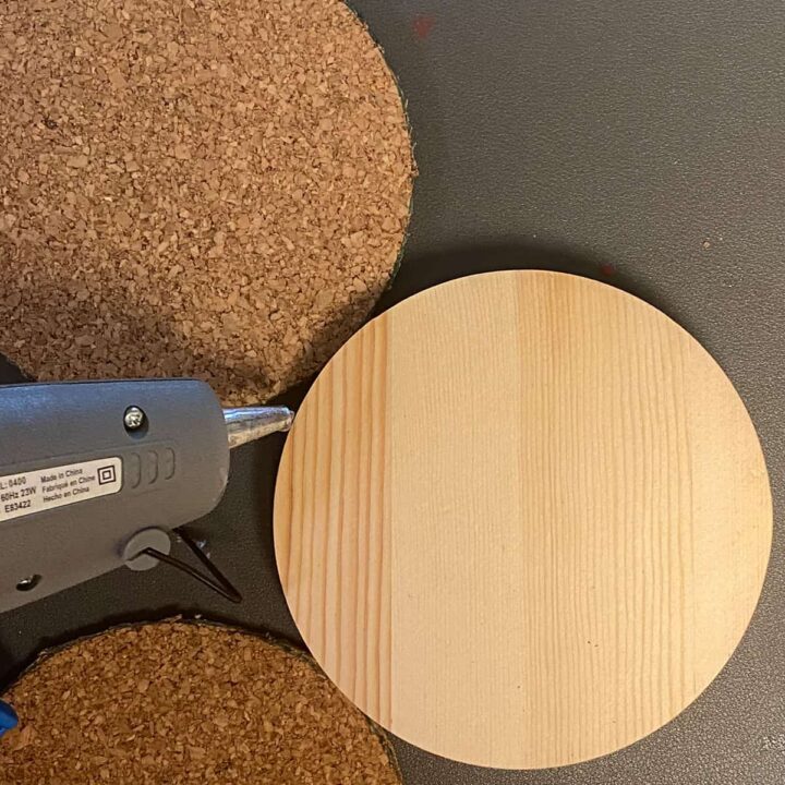 Hot glue the cork to top and bottom of wood