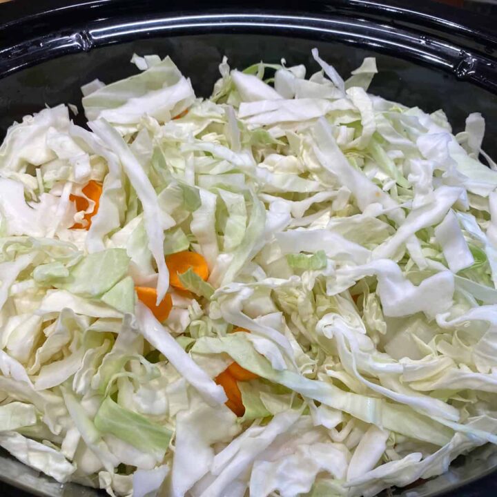 add cabbage and carrots to slow cooker