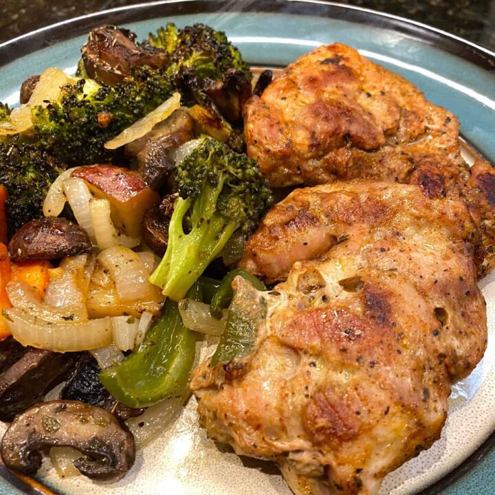 Chicken Thigh Sheet Pan Recipe with Broccoli Sweet Potato and Bell Pepper on a plate