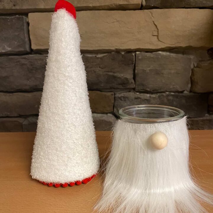 The glass jar finished and gnome hat finished next to each other in the picture.