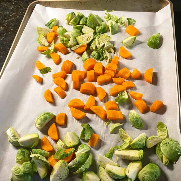 Cut brussel sprouts and place on baking sheet