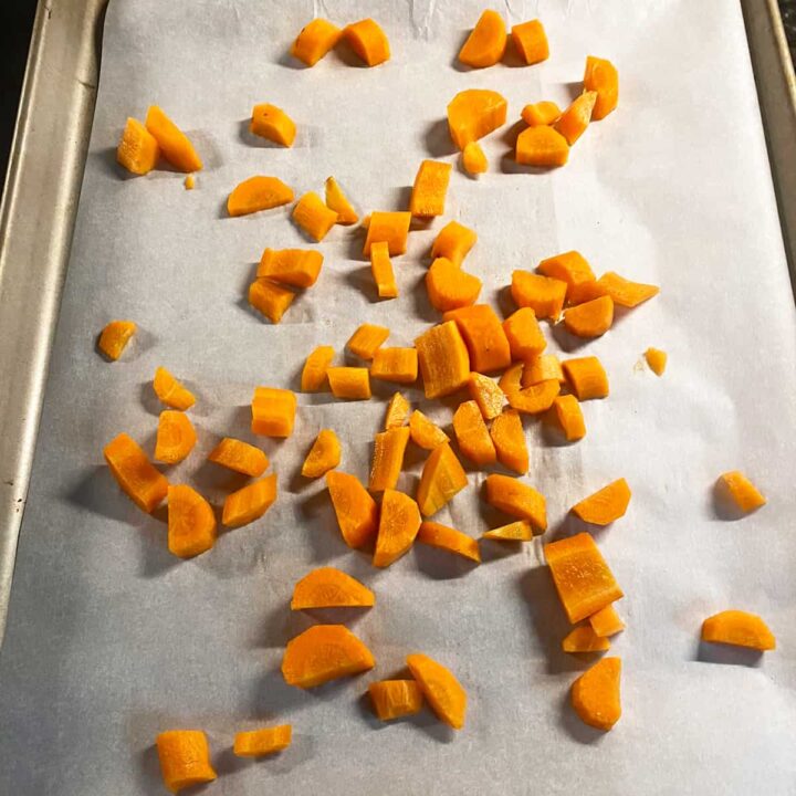 cut carrots and add to baking sheet