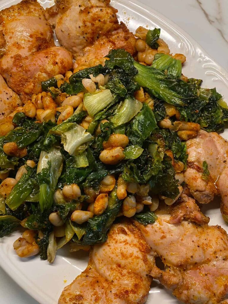 Chicken Thighs with White Beans and Escarole on platter - featured image