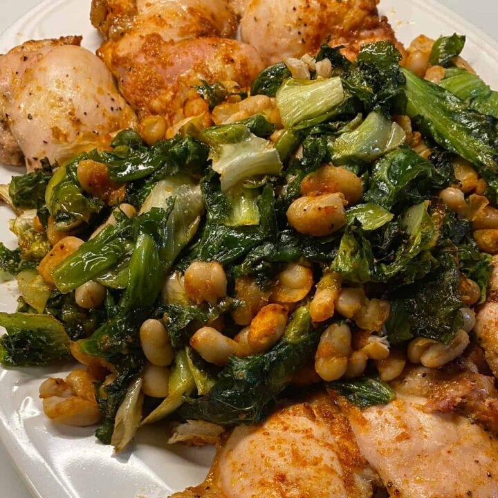Chicken Thighs with White Beans and Escarole on platter - square image