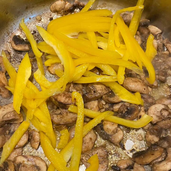 add sliced yellow bell pepper to skillet