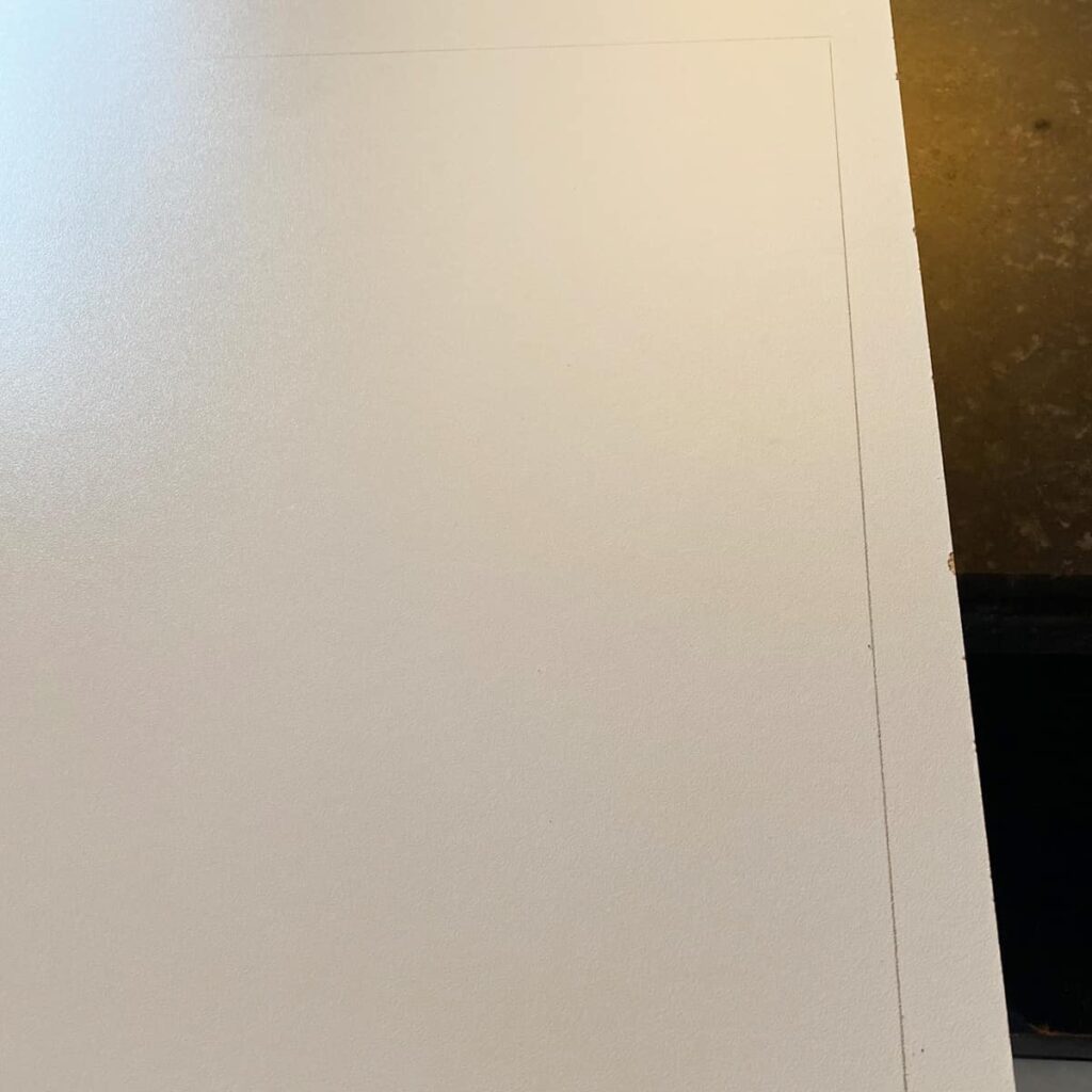 trace the existing shelf on to the melamine board to make the new shelves