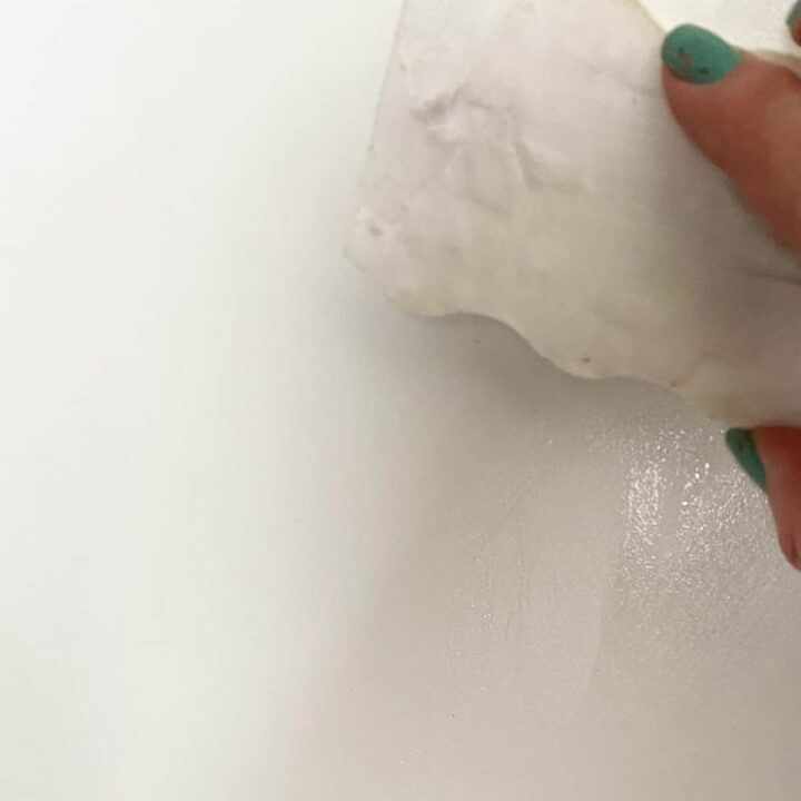 Wipe off the pencil marks from the shelves with a Magic Eraser
