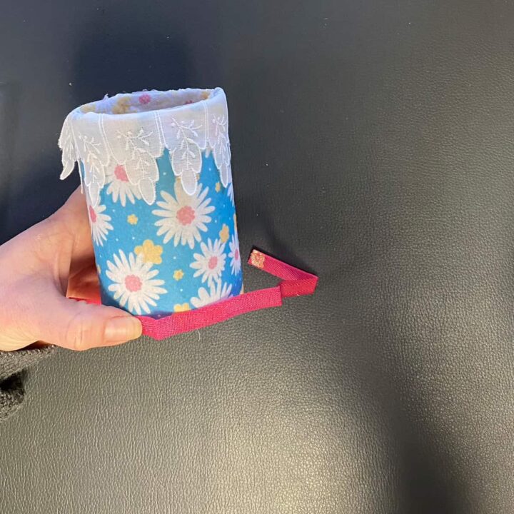 Add the ribbon to bottom on top of the flower felt on the outside of can