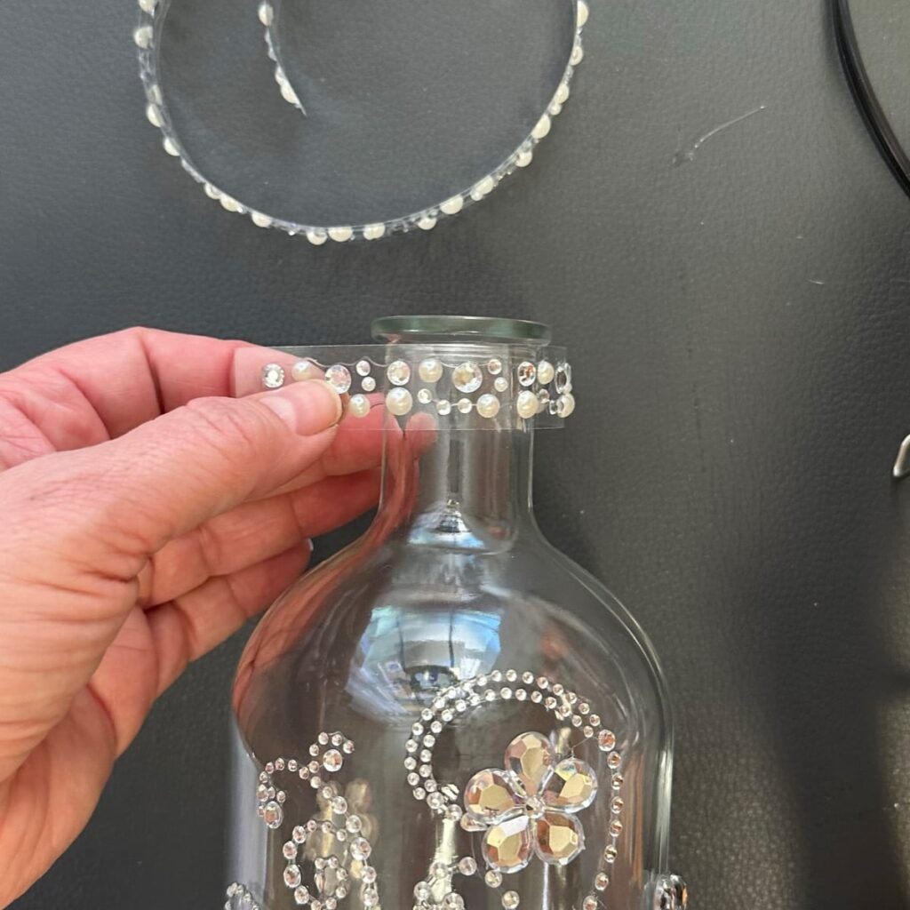 add the bling ribbon to top of bottle