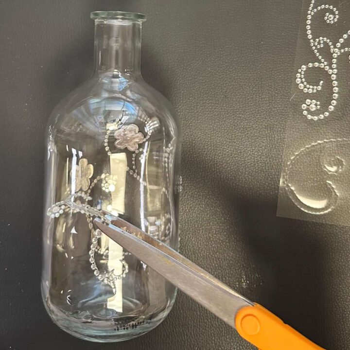 Cut the bling to fit on bottle with scissors