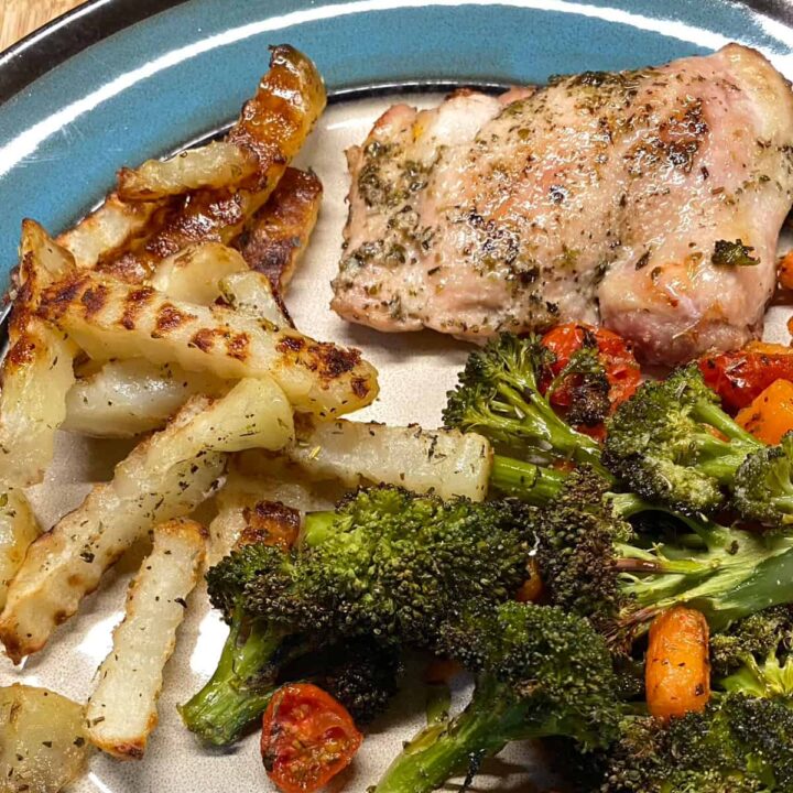Chicken Thigh and Broccoli recipe with carrots Tomatoes and fries - sheet pan recipe square image