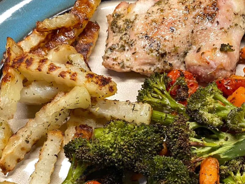 Chicken Thigh and Broccoli recipe with carrots Tomatoes and fries - sheet pan recipe square image