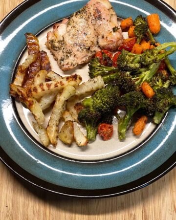 Chicken Thigh and Broccoli recipe with carrots Tomatoes and fries - sheet pan recipe