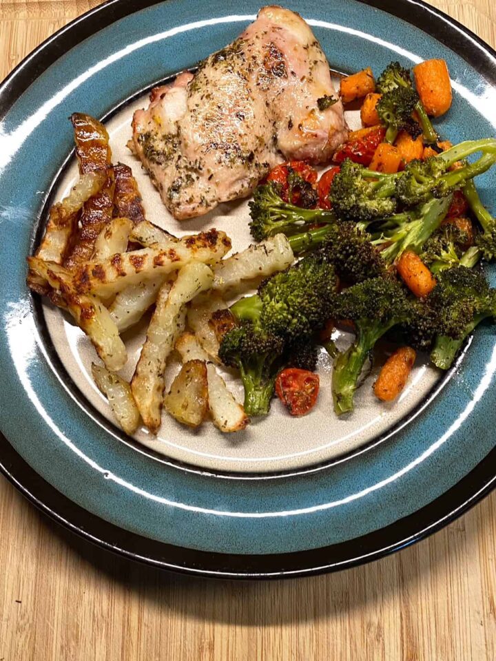 Chicken Thigh and Broccoli recipe with carrots Tomatoes and fries - sheet pan recipe