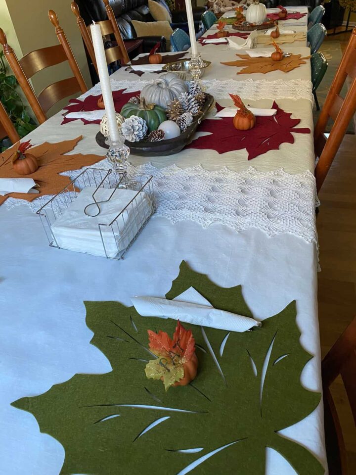 table scape with leaf placemats and linen and lace runners