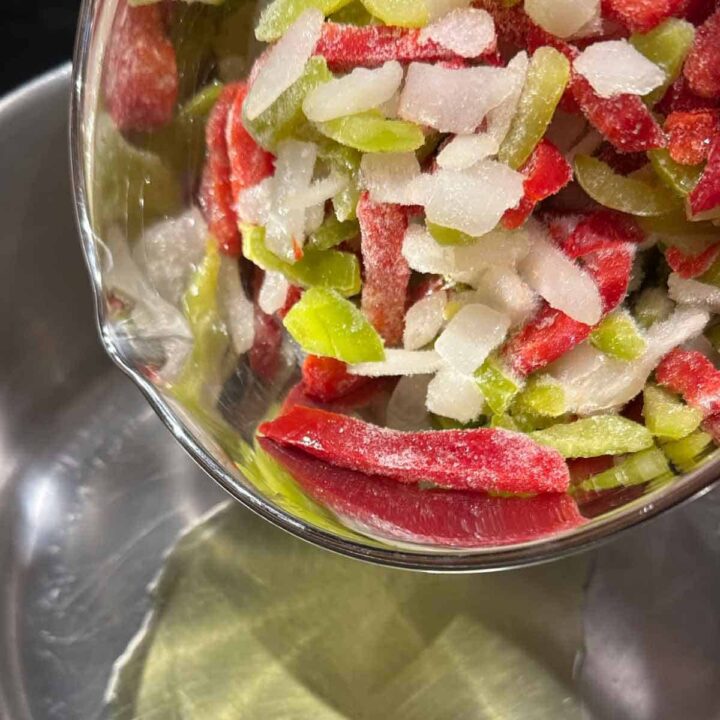 Add frozen peppers and onions