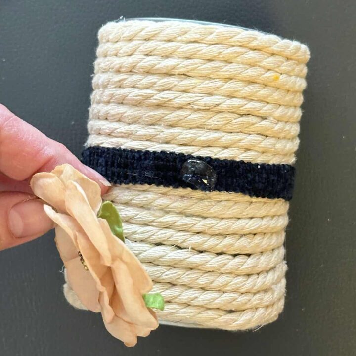 Add flower to navy blue rope