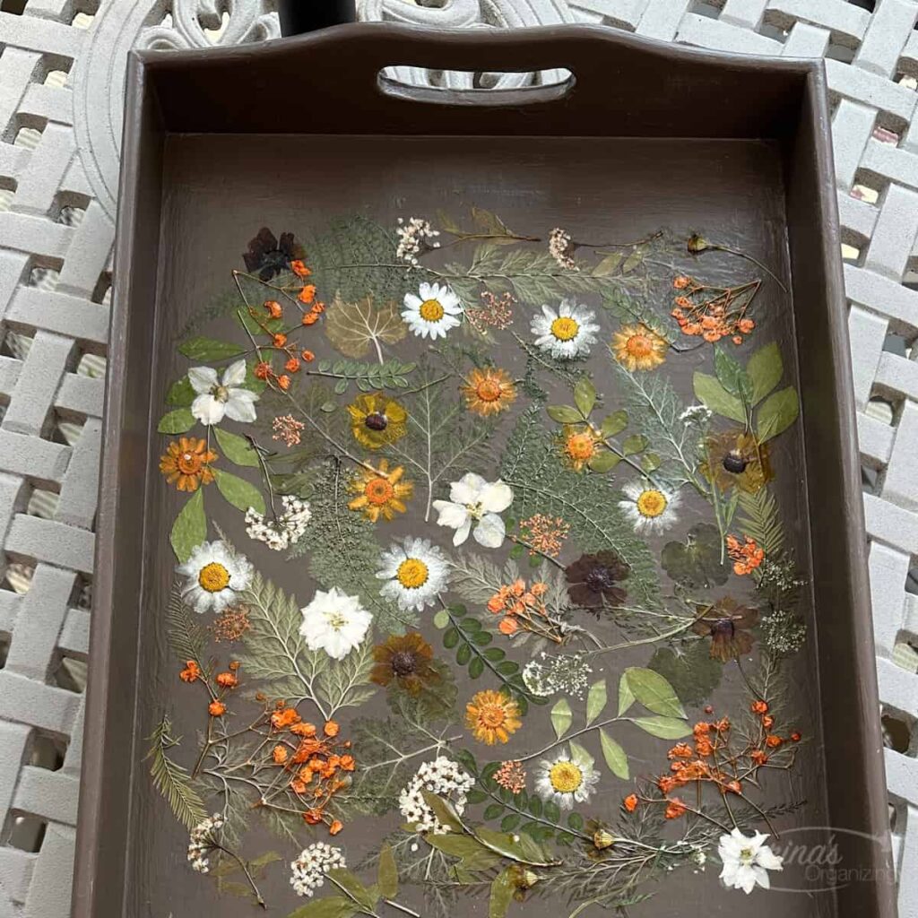 How to Decorate a Tray with Pressed Flowers using Mod Podge on a table