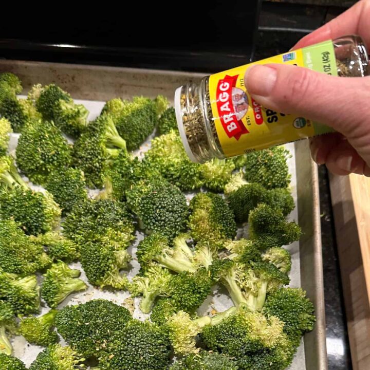 Add seasoning to broccoli and sweet potato