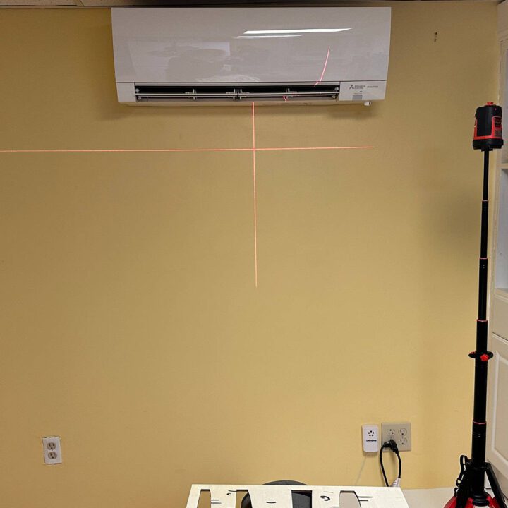 BEFORE IMAGE - center on the wall and line up the laser level line to the top of the panels