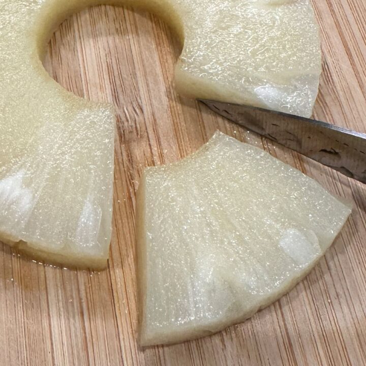 Cut a wedge out of the pineapples slices